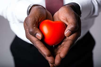 Hands holding a heart-shaped object