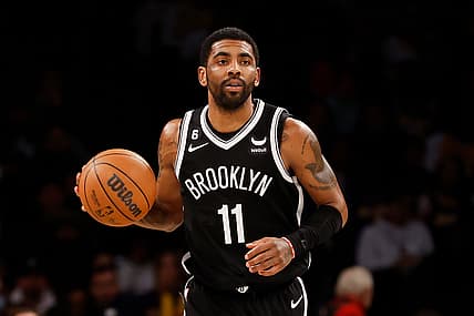 Kyrie Irving of the Brooklyn Nets with a basketball