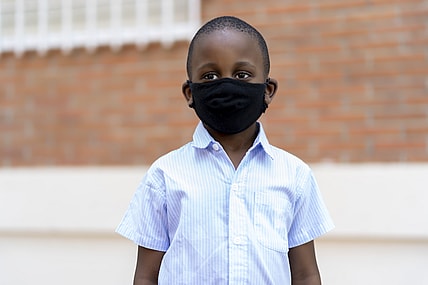 Black boy wearing mask