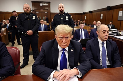 Former President Donald Trump sits at the defense table in Manhattan criminal court