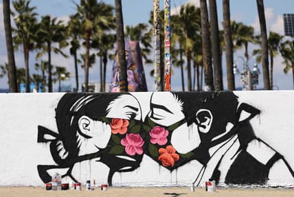 mural kissing coronavirus theGrio.com