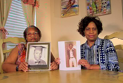 In this Wednesday, April 10, 2019, photo Mylinda Byrd Washington, 66, right, and Louvon Byrd Harris, 61, hold up photographs of their brother James Byrd Jr. in Houston. James Byrd Jr. was the victim of what is considered to be one of the most gruesome hate crime murders in recent Texas history. (AP Photo/Juan Lozano) thegrio.com