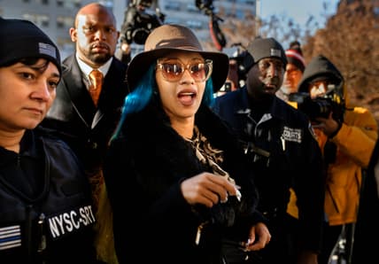 Rapper Cardi B, center, arrives at Queens County Criminal Court, Friday, Dec. 7, 2018, in New York. The platinum-selling hip hop star is scheduled to appear in court on charges related to a brawl at a New York strip club. (AP Photo/Andres Kudacki) thegrio.com