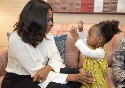 Michelle Obama dances with Parker Curry. thegrio.com