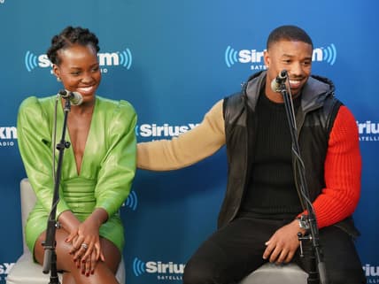 NEW YORK, NY - FEBRUARY 13: Lupita Nyong'o and Michael B. Jordan take part in SiriusXM's Town Hall with the cast of Black Panther hosted by SiriusXM's Sway Calloway on February 13, 2018 in New York City. (Photo by Cindy Ord/Getty Images for SiriusXM) thegrio.com