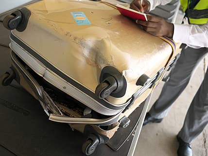 damaged luggage theGrio.com