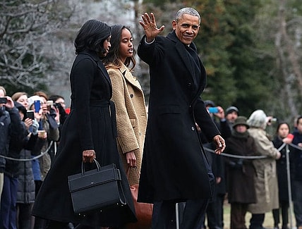 WASHINGTON, DC - JANUARY 10: U.S. President Barack Obama waves as he walks with first lady Michelle Obama and daughter Malia, toward Marine One while departing from the White House, on January 10, 2017 in Washington, DC. President Obama is traveling to Chicago where he will deliver his farewell speech. (Photo by Mark Wilson/Getty Images) thegrio.com