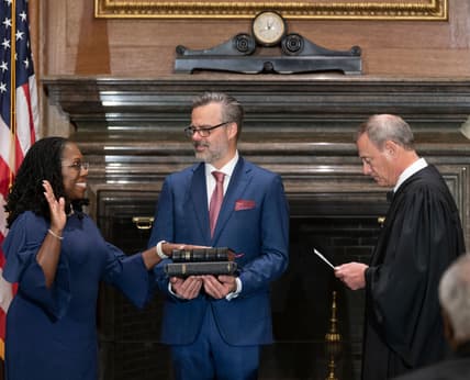 Chief Justice John G. Roberts, Jr., right, administers the Constitutional Oath to Judge Ketanji Brown Jackson