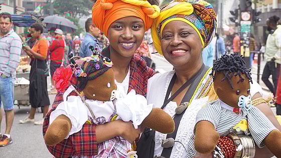 Black Consciousness Day Parade in São Paulo. She was just one-year-old when her grandmother brought her to her first parade. These days, dressed traditionally in headwraps and long skirts, she and her grandmother are seen at the annual event carryin thegrio.com