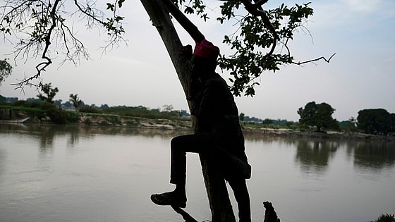 Man stands on the banks of the Yobe river in Nigeria