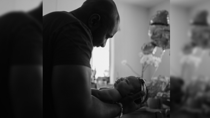Karega Bailey holds his daughter Kamali Sade Sol Bailey