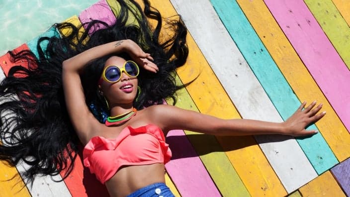 Girl relaxing by water shows how you could be living on your next Puerto Rico vacation.