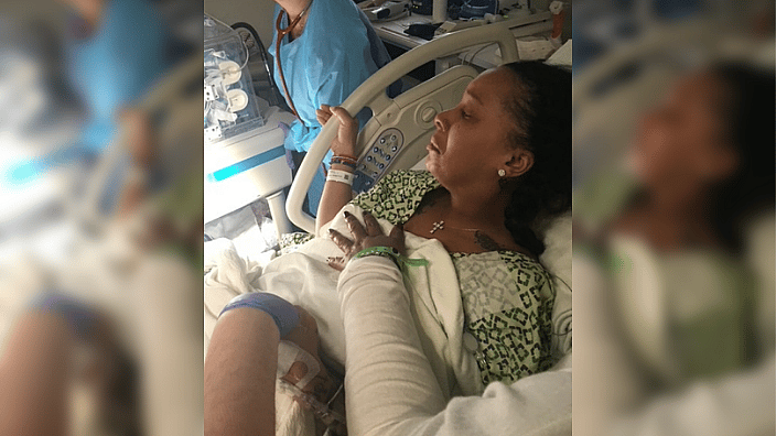 Shirley Smith in hospital bed during premature birth.