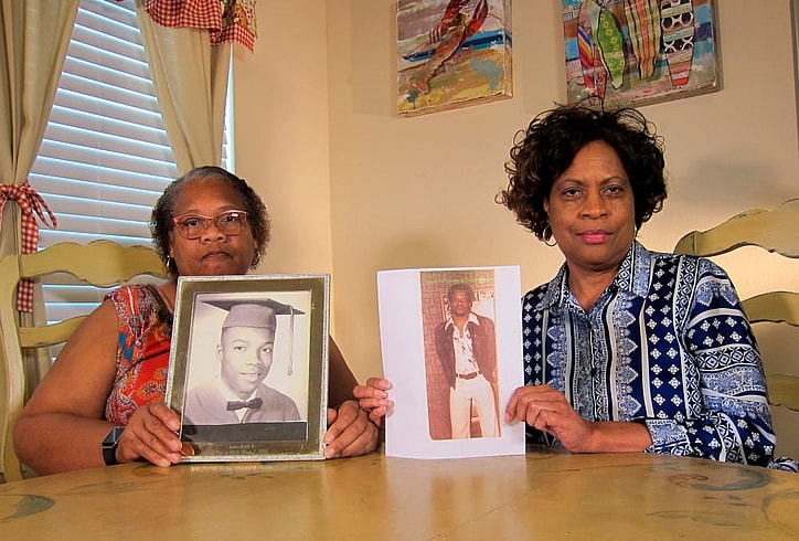 In this Wednesday, April 10, 2019, photo Mylinda Byrd Washington, 66, right, and Louvon Byrd Harris, 61, hold up photographs of their brother James Byrd Jr. in Houston. James Byrd Jr. was the victim of what is considered to be one of the most gruesome hate crime murders in recent Texas history. (AP Photo/Juan Lozano) thegrio.com