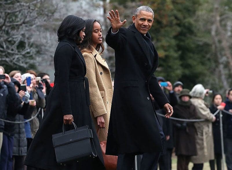 WASHINGTON, DC - JANUARY 10: U.S. President Barack Obama waves as he walks with first lady Michelle Obama and daughter Malia, toward Marine One while departing from the White House, on January 10, 2017 in Washington, DC. President Obama is traveling to Chicago where he will deliver his farewell speech. (Photo by Mark Wilson/Getty Images) thegrio.com