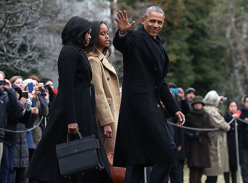 WASHINGTON, DC - JANUARY 10: U.S. President Barack Obama waves as he walks with first lady Michelle Obama and daughter Malia, toward Marine One while departing from the White House, on January 10, 2017 in Washington, DC. President Obama is traveling to Chicago where he will deliver his farewell speech. (Photo by Mark Wilson/Getty Images) thegrio.com