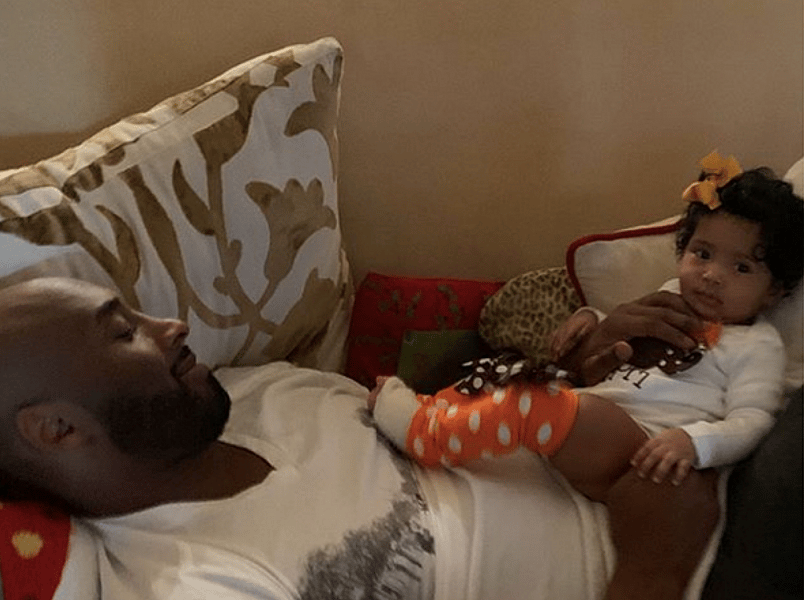Kobe Bryant and youngest daughter Capri during Thanksgiving theGrio.com