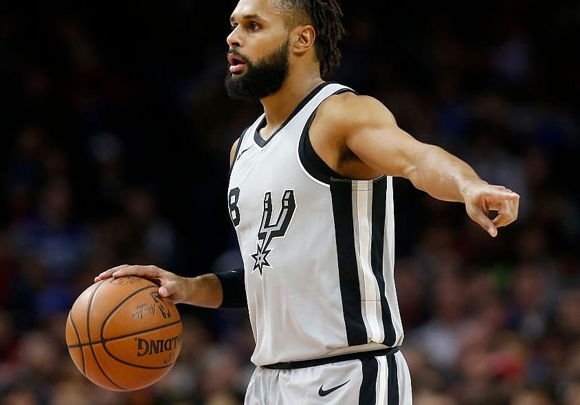 PHILADELPHIA, PA - JANUARY 3: Patty Mills #8 of the San Antonio Spurs dribbles the ball against the Philadelphia 76ers in the first half at Wells Fargo Center on January 3, 2018 in Philadelphia, Pennsylvania. NOTE TO USER: User expressly acknowledges and agrees that, by downloading and or using this photograph, User is consenting to the terms and conditions of the Getty Images License Agreement. (Photo by Rob Carr/Getty Images) thegrio.com