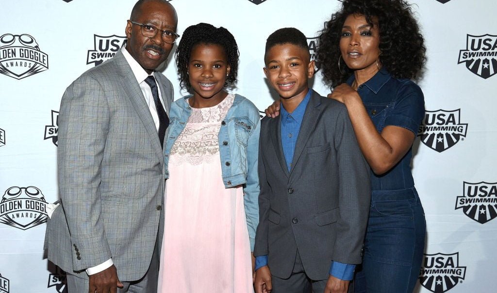 LOS ANGELES, CA - NOVEMBER 19: Courtney B. Vance, Bronwyn Vance, Slater Vance and Angela Bassett attend the 2017 USA Swimming Golden Goggle Awards at J.W. Marriott at L.A. Live on November 19, 2017, in Los Angeles, California. (Photo by Kevork Djansezian) thegrio.com