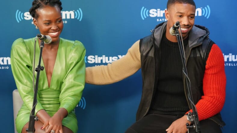 NEW YORK, NY - FEBRUARY 13: Lupita Nyong'o and Michael B. Jordan take part in SiriusXM's Town Hall with the cast of Black Panther hosted by SiriusXM's Sway Calloway on February 13, 2018 in New York City. (Photo by Cindy Ord/Getty Images for SiriusXM) thegrio.com