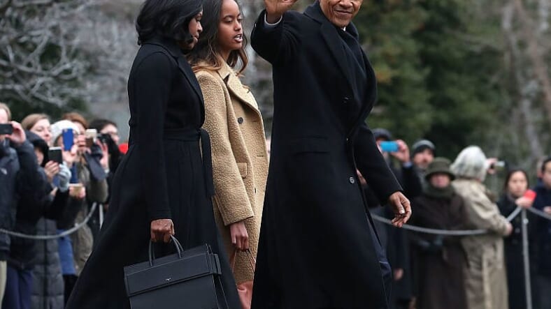 WASHINGTON, DC - JANUARY 10: U.S. President Barack Obama waves as he walks with first lady Michelle Obama and daughter Malia, toward Marine One while departing from the White House, on January 10, 2017 in Washington, DC. President Obama is traveling to Chicago where he will deliver his farewell speech. (Photo by Mark Wilson/Getty Images) thegrio.com