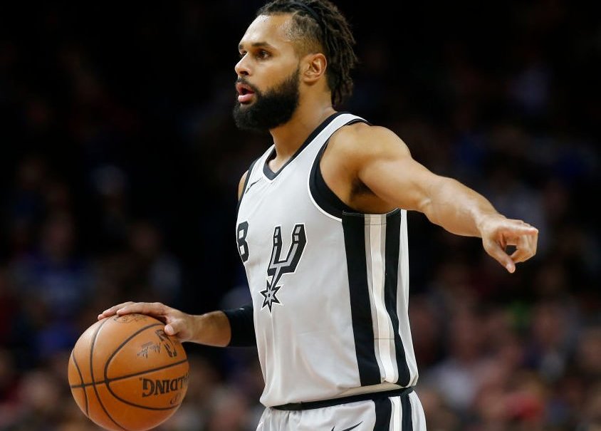 PHILADELPHIA, PA - JANUARY 3: Patty Mills #8 of the San Antonio Spurs dribbles the ball against the Philadelphia 76ers in the first half at Wells Fargo Center on January 3, 2018 in Philadelphia, Pennsylvania. NOTE TO USER: User expressly acknowledges and agrees that, by downloading and or using this photograph, User is consenting to the terms and conditions of the Getty Images License Agreement. (Photo by Rob Carr/Getty Images) thegrio.com