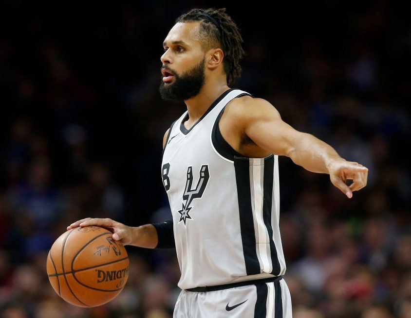 PHILADELPHIA, PA - JANUARY 3: Patty Mills #8 of the San Antonio Spurs dribbles the ball against the Philadelphia 76ers in the first half at Wells Fargo Center on January 3, 2018 in Philadelphia, Pennsylvania. NOTE TO USER: User expressly acknowledges and agrees that, by downloading and or using this photograph, User is consenting to the terms and conditions of the Getty Images License Agreement. (Photo by Rob Carr/Getty Images) thegrio.com