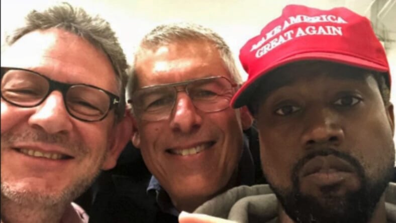 Kanye West and MAGA hat thegrio.com