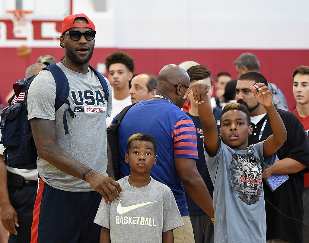 LeBron James lights up while celebrating son Bronny's slam dunk finale