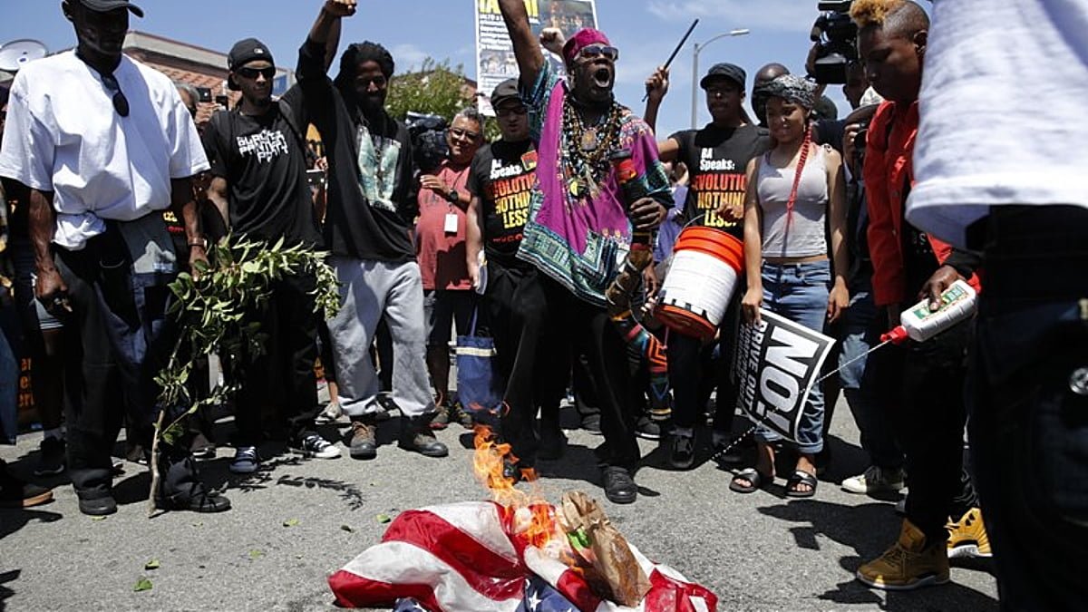 flag burned maxine waters thegrio.com