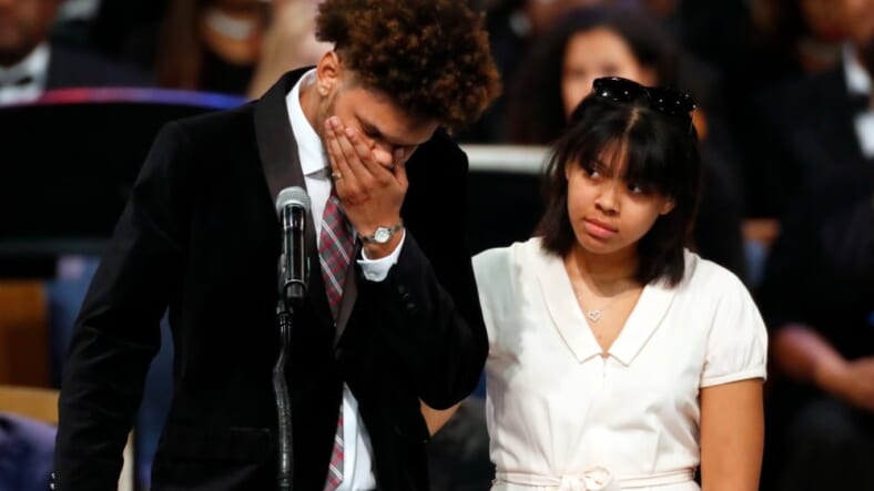 Jordan Franklin, left, pauses alongside his sister Victorie Franklin while speaking about their grandmother, Aretha Franklin, during the funeral service for the legendary singer at Greater Grace Temple, Friday, Aug. 31, 2018, in Detroit. Franklin died Aug. 16, 2018 of pancreatic cancer at the age of 76. (AP Photo/Paul Sancya)