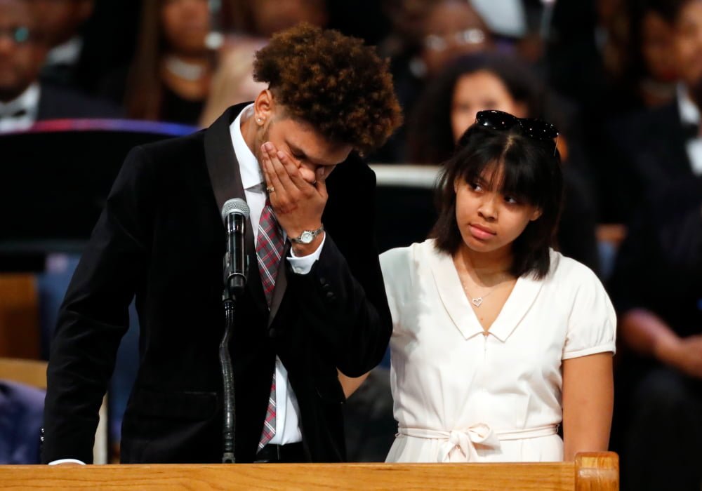 Jordan Franklin, left, pauses alongside his sister Victorie Franklin while speaking about their grandmother, Aretha Franklin, during the funeral service for the legendary singer at Greater Grace Temple, Friday, Aug. 31, 2018, in Detroit. Franklin died Aug. 16, 2018 of pancreatic cancer at the age of 76. (AP Photo/Paul Sancya)