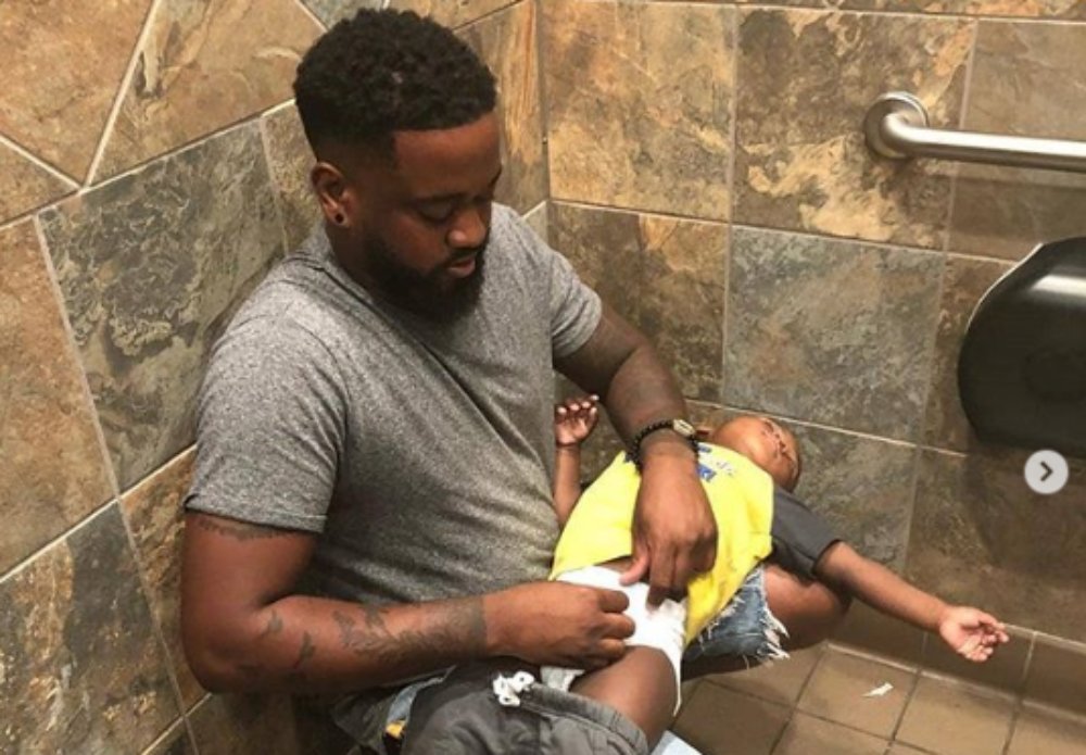 Dad goes viral after posting photo of him changing baby's diaper thegrio.com
