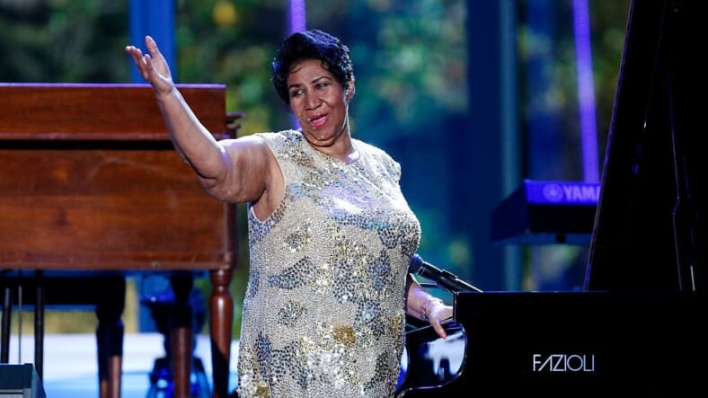Aretha Franklin waves after her performance at the International Jazz Day Concert (Photo by Aude Guerrucci-Pool/Getty Images)