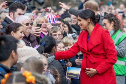 Meghan, Duchess of Sussex greet well-wishers on Hamilton Square as they visit a new statue to mark the 100th anniversary of the death of poet Wilfred Owen, which was erected on Hamilton Square in November, during an official visit to Birkenhead on January 14, 2019 in Birkenhead, United Kingdom. (Photo by Charlotte Graham - WPA Pool/Getty Images) thegrio.com
