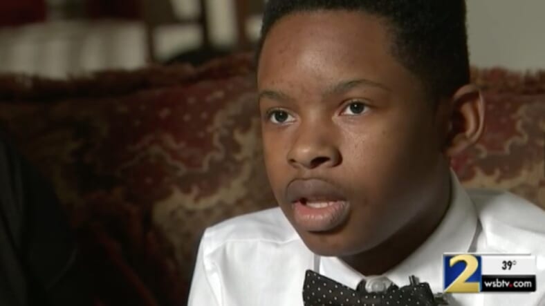 Christian Philon says he was suspended for using money he didn't know what fake to pay for school lunch. (WSB-TV)