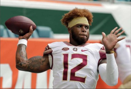 In this Saturday, Oct. 6, 2018, file photo, Florida State quarterback Deondre Francois (12) warms up before an NCAA college football game against Miami, in Miami Gardens, Fla. Florida State head football coach Willie Taggart announced Sunday, Feb. 3, 2019, that Francois has been dismissed from the team after allegations of domestic abuse surfaced. (AP Photo/Lynne Sladky, File) thegrio.com