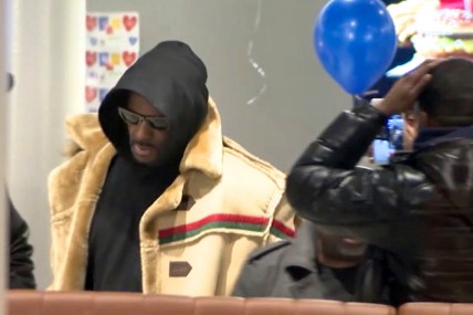 In this image made from a video, R. Kelly stops at a McDonald's restaurant in Chicago Monday, Feb. 25, 2019, after a suburban Chicago woman posted the $100,000 bail for R. Kelly to be freed from jail while he awaits trial on sexual abuse charges. R. Kelly signed autographs and waved at a fan who yelled "I love you!" when he stopped at McDonald's in downtown Chicago. (WFLD via AP) thegrio.com