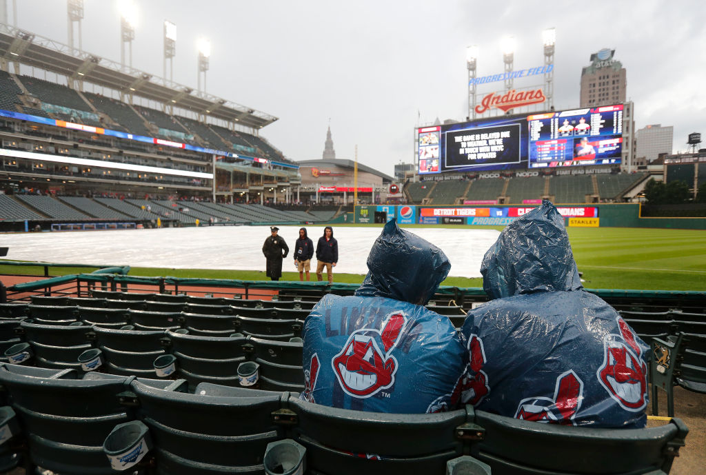 CLEVELAND, OH - JUNE 22: Cleveland Indians fans wait out a rain delay before the start of the game against the Detroit Tigers at Progressive Field on June 22, 2018 in Cleveland, Ohio. (Photo by David Maxwell/Getty Images)