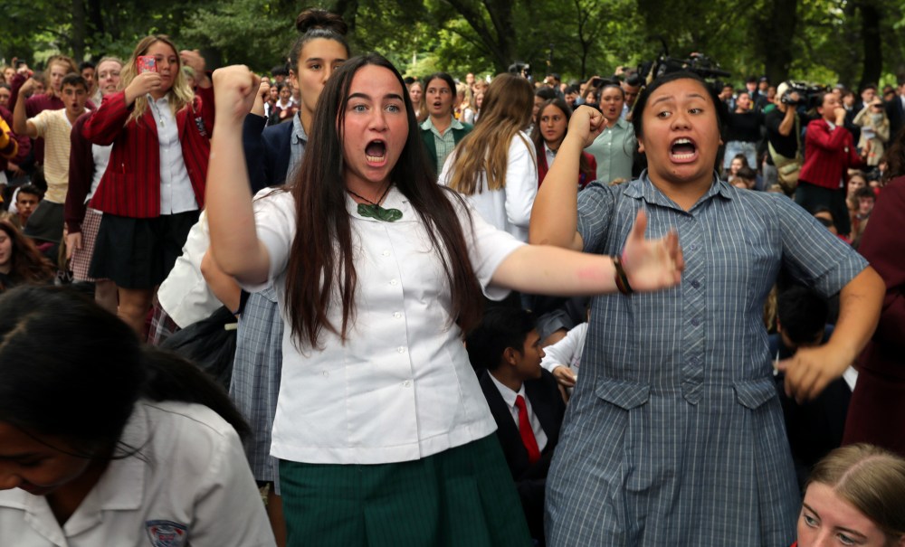 Students perform the Haka during a vigil to commemorate victims of Friday's shooting, outside the Al Noor mosque in Christchurch, New Zealand, Monday, March 18, 2019. Three days after Friday's attack, New Zealand's deadliest shooting in modern history, relatives were anxiously waiting for word on when they can bury their loved ones. (AP Photo/Vincent Thian) thegrio.com