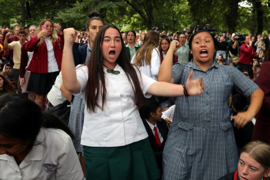 Students perform the Haka during a vigil to commemorate victims of Friday's shooting, outside the Al Noor mosque in Christchurch, New Zealand, Monday, March 18, 2019. Three days after Friday's attack, New Zealand's deadliest shooting in modern history, relatives were anxiously waiting for word on when they can bury their loved ones. (AP Photo/Vincent Thian) thegrio.com
