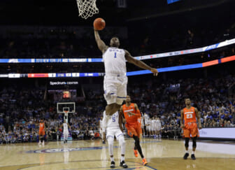 Duke's Zion Williamson (1) goes up to dunk against Syracuse during the first half of an NCAA college basketball game in the Atlantic Coast Conference tournament in Charlotte, N.C., Thursday, March 14, 2019. (AP Photo/Chuck Burton)