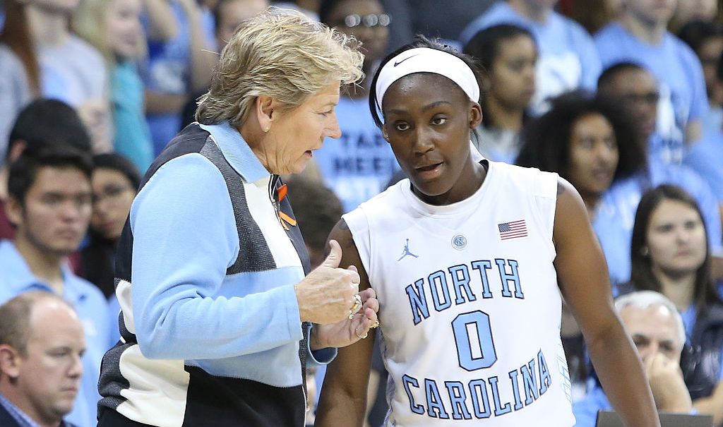 16 November 2014: UNC head coach Sylvia Hatchell (left) talks with Jamie Cherry (0). The University of North Carolina Tar Heels hosted the University of California Los Angeles Bruins at Carmichael Arena in Chapel Hill, North Carolina in a 2014-15 NCAA Division I Women's Basketball game. UNC won the game 84-68. (Photo by Andy Mead/YCJ/Icon Sportswire/Corbis via Getty Images) thegrio.com