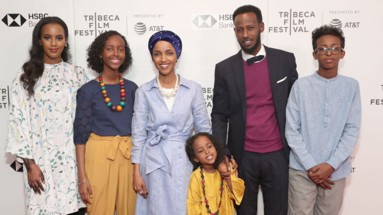 NEW YORK, NY - APRIL 21: Amal Sabrie, Isra Hirsi, Ilhan Omar, Ilwad Hirsi, Ahmed Hirsi, Adnan Hirsi attend the premiere of "Time For Ilhan" during the 2018 Tribeca Film Festival at Cinepolis Chelsea on April 21, 2018 in New York City. (Photo by Astrid Stawiarz/Getty Images for Tribeca Film Festival) thegrio.com