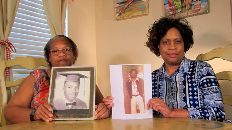 In this Wednesday, April 10, 2019, photo Mylinda Byrd Washington, 66, right, and Louvon Byrd Harris, 61, hold up photographs of their brother James Byrd Jr. in Houston. James Byrd Jr. was the victim of what is considered to be one of the most gruesome hate crime murders in recent Texas history. (AP Photo/Juan Lozano) thegrio.com