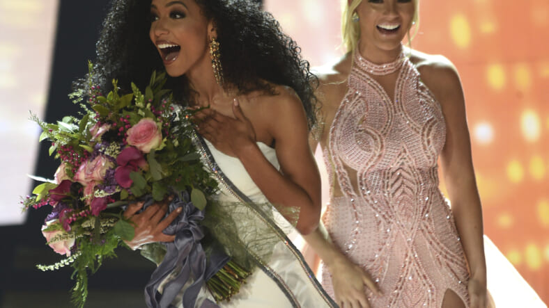 Miss North Carolina Cheslie Kryst, left, gets crowned by last year's winner Sarah Rose Summers, right, after winning the 2019 Miss USA final competition in the Grand Theatre in the Grand Sierra Resort in Reno, Nev., on Thursday, May 2, 2019. Kryst, a 27-year-old lawyer from North Carolina who represents some prison inmates for free, won the 2019 Miss USA title Thursday night in a diverse field that included teachers, nurses and members of the military. (Jason Bean/The Reno Gazette-Journal via AP) thegrio.com