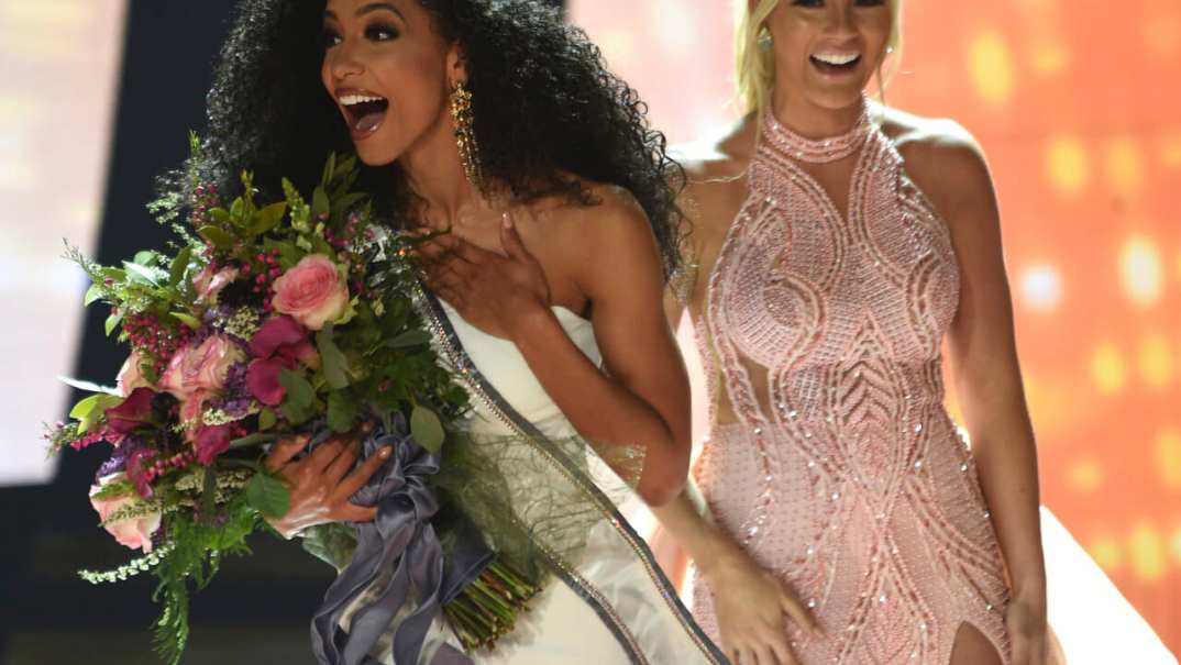 Miss North Carolina Cheslie Kryst, left, gets crowned by last year's winner Sarah Rose Summers, right, after winning the 2019 Miss USA final competition in the Grand Theatre in the Grand Sierra Resort in Reno, Nev., on Thursday, May 2, 2019. Kryst, a 27-year-old lawyer from North Carolina who represents some prison inmates for free, won the 2019 Miss USA title Thursday night in a diverse field that included teachers, nurses and members of the military. (Jason Bean/The Reno Gazette-Journal via AP) thegrio.com