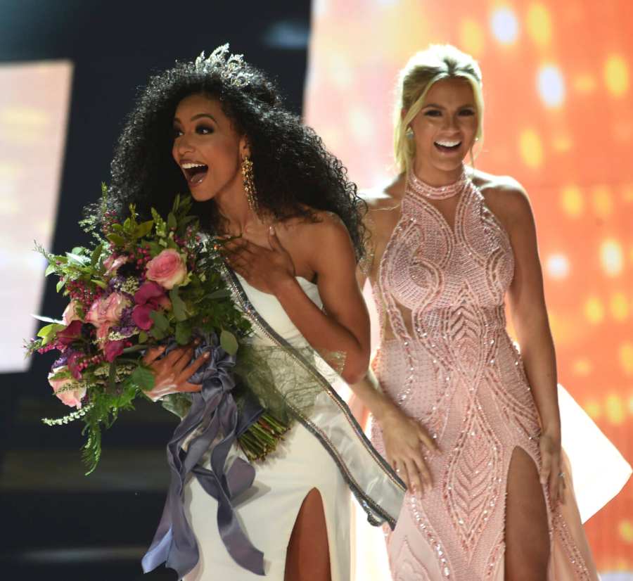 Miss North Carolina Cheslie Kryst, left, gets crowned by last year's winner Sarah Rose Summers, right, after winning the 2019 Miss USA final competition in the Grand Theatre in the Grand Sierra Resort in Reno, Nev., on Thursday, May 2, 2019. Kryst, a 27-year-old lawyer from North Carolina who represents some prison inmates for free, won the 2019 Miss USA title Thursday night in a diverse field that included teachers, nurses and members of the military. (Jason Bean/The Reno Gazette-Journal via AP) thegrio.com