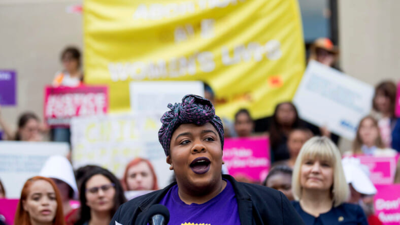 Michelle Wilson, Program Manager for Women Engaged, speaks out against Georgia's restrictive abortion bill and for reproductive justice at a press conference outside of the Georgia State Capitol following the signing of HB 481 in Atlanta, Tuesday, May 7, 2019. Georgia Governor Brian Kemp signed the bill, surrounded by supporters and Georgia lawmakers, in his office Tuesday morning. (ALYSSA POINTER/ALYSSA.POINTER@AJC.COM)