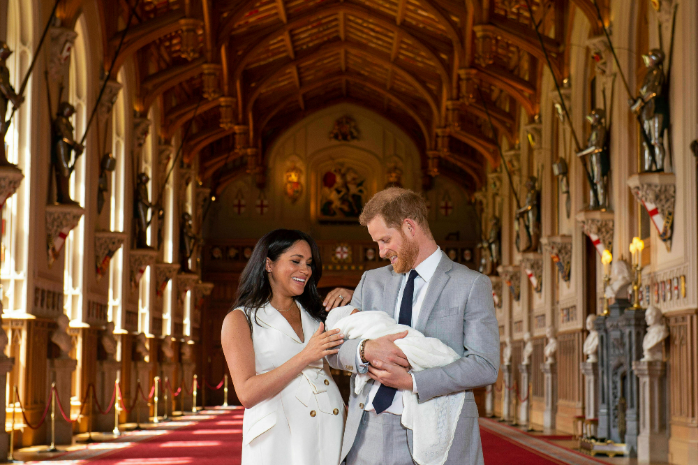 Britain's Prince Harry and Meghan, Duchess of Sussex, during a photocall with their newborn son, in St George's Hall at Windsor Castle, Windsor, south England, Wednesday May 8, 2019. Baby Sussex was born Monday at 5:26 a.m. (0426 GMT; 12:26 a.m. EDT) at an as-yet-undisclosed location. An overjoyed Harry said he and Meghan are "thinking" about names. (Dominic Lipinski/Pool via AP) thegrio.com